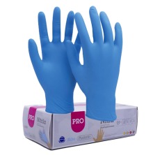 Ett par bla nitrilhandskar och en frpackning